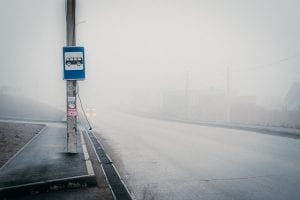 mobility strategy. Image shows city bus stop in heavy fog