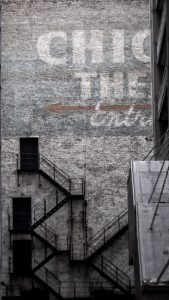 block clubs: photo shows a Chicago building with painted lettering