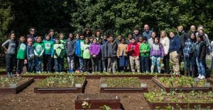 Michelle Obama with kids who planted seedlings in the White House garden