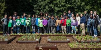 Michelle Obama with kids who planted seedlings in the White House garden