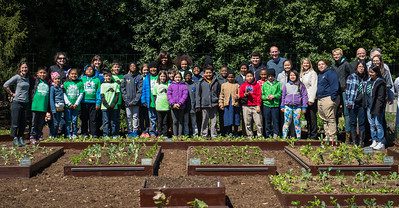 Michelle Obama with kids who planted seedlings in the White House garden