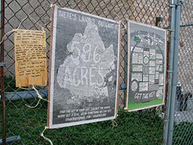 vacant lots: Signs posted on fences in Bushwick, NYC