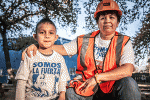 Female construction worker and her son.