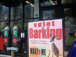 A sign advertising a dog day care center with valet parking. A dog wearing a bow-tie can be seen on the sign. Much attention has been given to metro and city-level segregation; however, little consideration has been given to segregation in mixed-income communities.