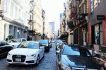 Cars on downtown New York City street.