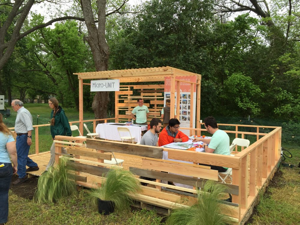 Residents in Austin, Texas, sit in a micro-unit home.