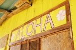 Yellow sign reading 'Aloha.'