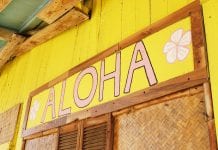 Yellow sign reading 'Aloha.'