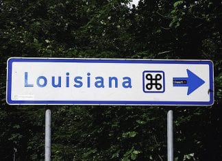 A blue and white Louisiana road sign.