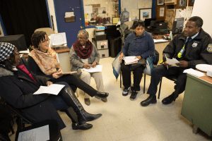 A group of activists and community-based partners in Philadelphia discuss how to deal with a Mantua neighborhood hotspot and possibly solve the problem through a process called “crime prevention through environmental design.”