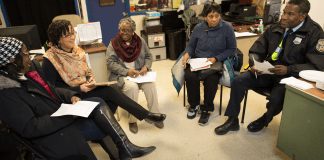 A group of activists and community-based partners in Philadelphia discuss how to deal with a Mantua neighborhood hotspot and possibly solve the problem through a process called “crime prevention through environmental design.”
