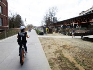 A bicyclist and pedestrians on Atlanta's BeltLine.