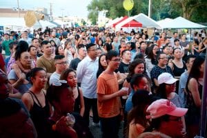 A crowd of people gather a Little Mekong Night Market in St. Paul. This is an example of food-oriented development.