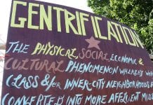 sign defining "gentrification"
