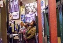 Women looking at museum exhibit