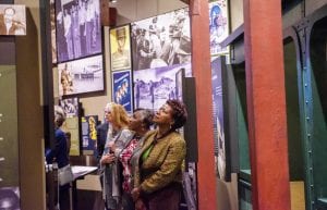 Women looking at museum exhibit