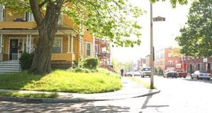 A yellow house on a corner.