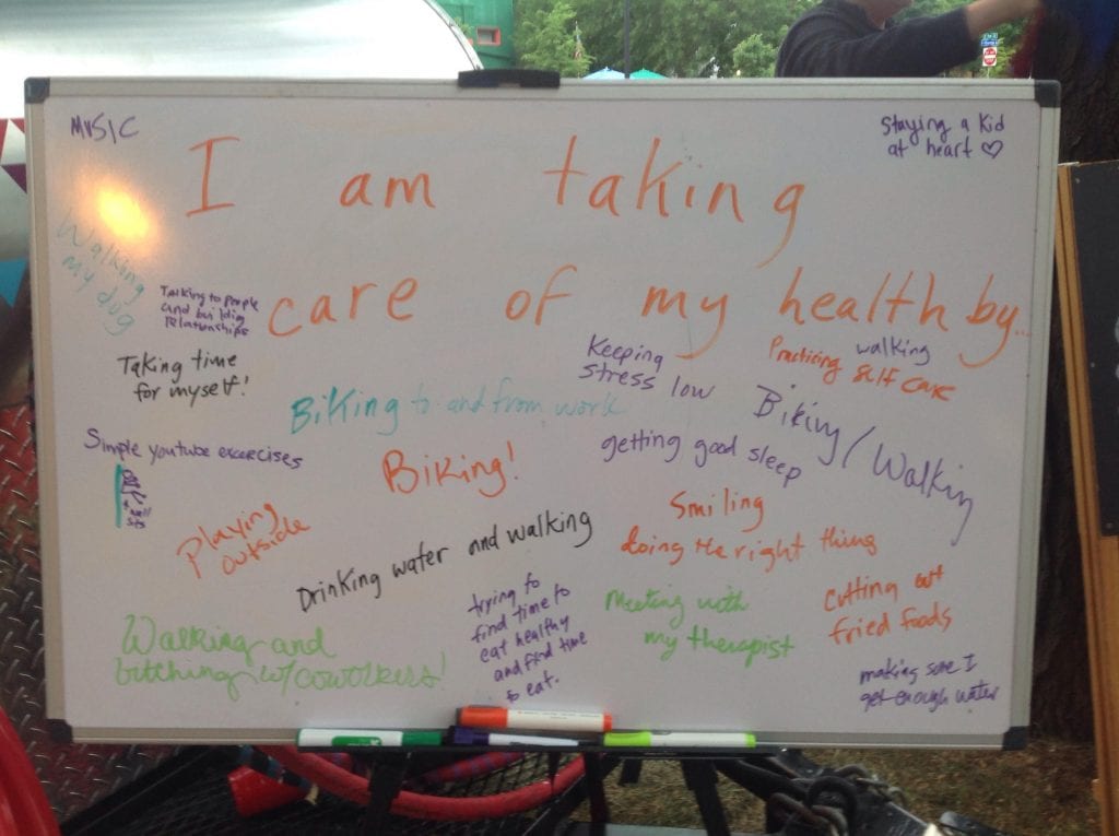 A board that has examples of what people are doing to take care of their health.