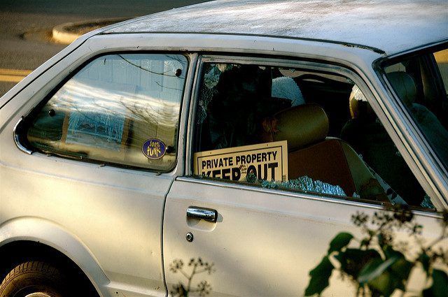 car with private property sign