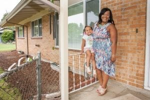 An African-American woman and her daughter stand outside of their Portland home, which is a community land trust home. Portland's preference policy gives priority for homeownership opportunities funded by the city’s housing bureau to residents who were displaced. 