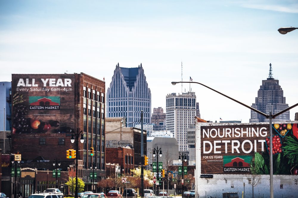 Eastern Market food advertisement banners on old buildings in downtown Detriot.