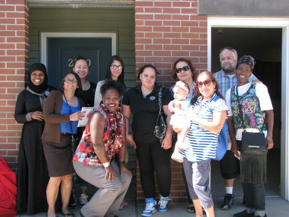 The first community justice land trust tenants at Grace Townhomes. Photo courtesy of DHCD