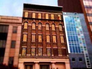 old and new buildings in Harlem