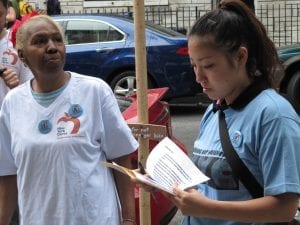 Two women count vacant buildings in New York City as part of an effort to end warehousing in the city.