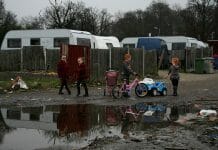 Children play on an Irish Traveller site on Dale Farm in 2011. A young boy with glasses rubs his eyes outside in Dale Farm, which was once the site of the largest Irish Traveller concentration until families were evicted in 2011. A health impact assessment helped house this indigenous group.