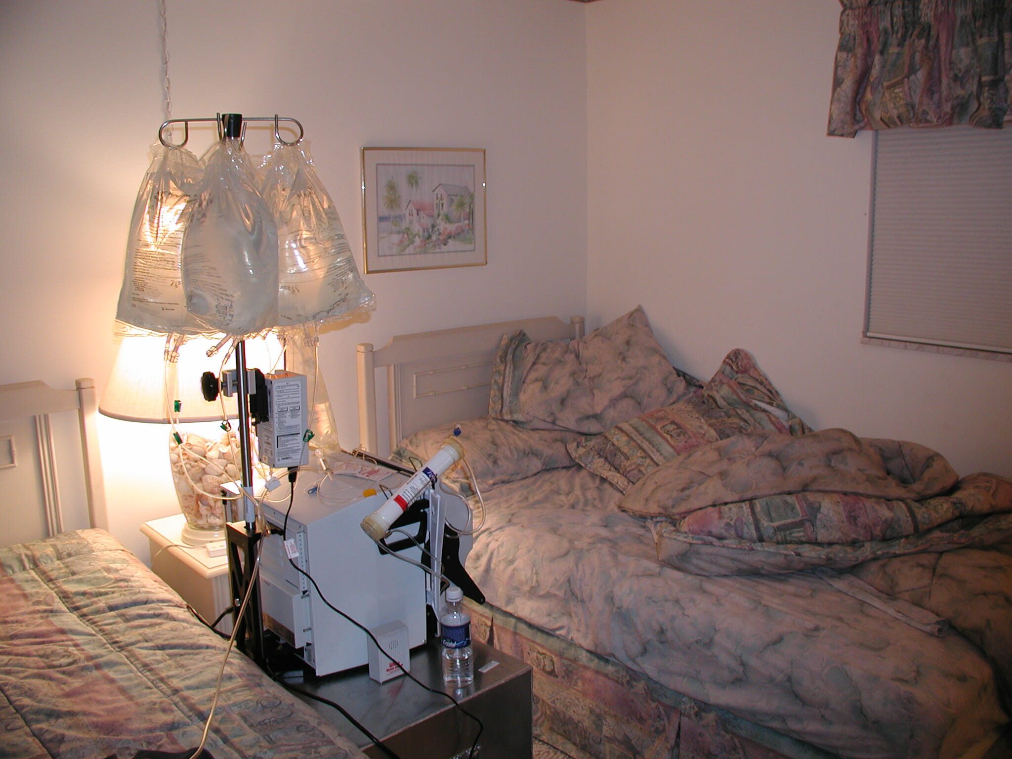 A hemodialysis machine in a bedroom. There would be great risk to the user of this machine if the utility company shut-off this home's electricity.