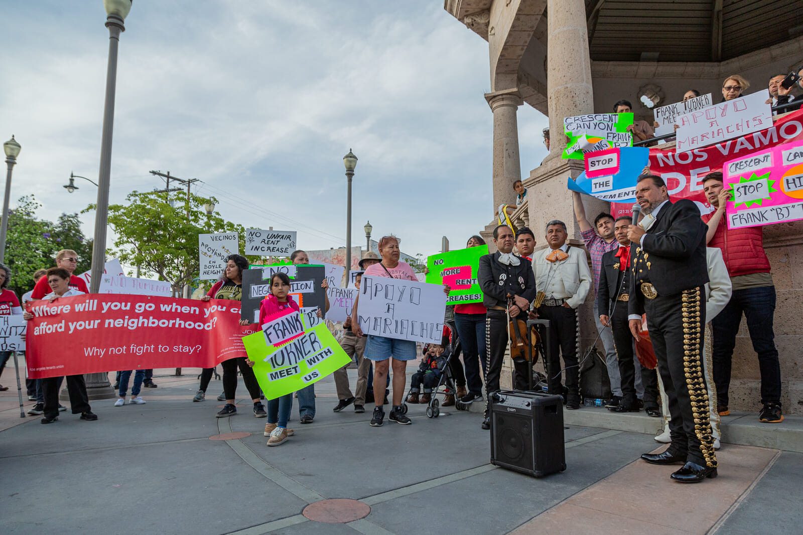 A mariachi speaks to residents in a Boyle Heights community after a landlord attempts to raise their rent by 60 to 80 percent. The group participated in rents strikes and negotiated a fair rent increase with their landlord.