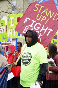 In Boston, a resident marches against a building eviction in 2017.