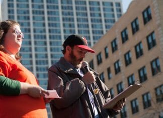 Chicago resident Tom Gordon speaks to a crowd. He, as well as other organizers, are fighting for a citywide community benefits campaign.