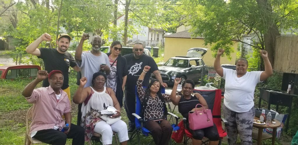 Good outcomes: North Minneapolis tenants celebrating with fists in the air