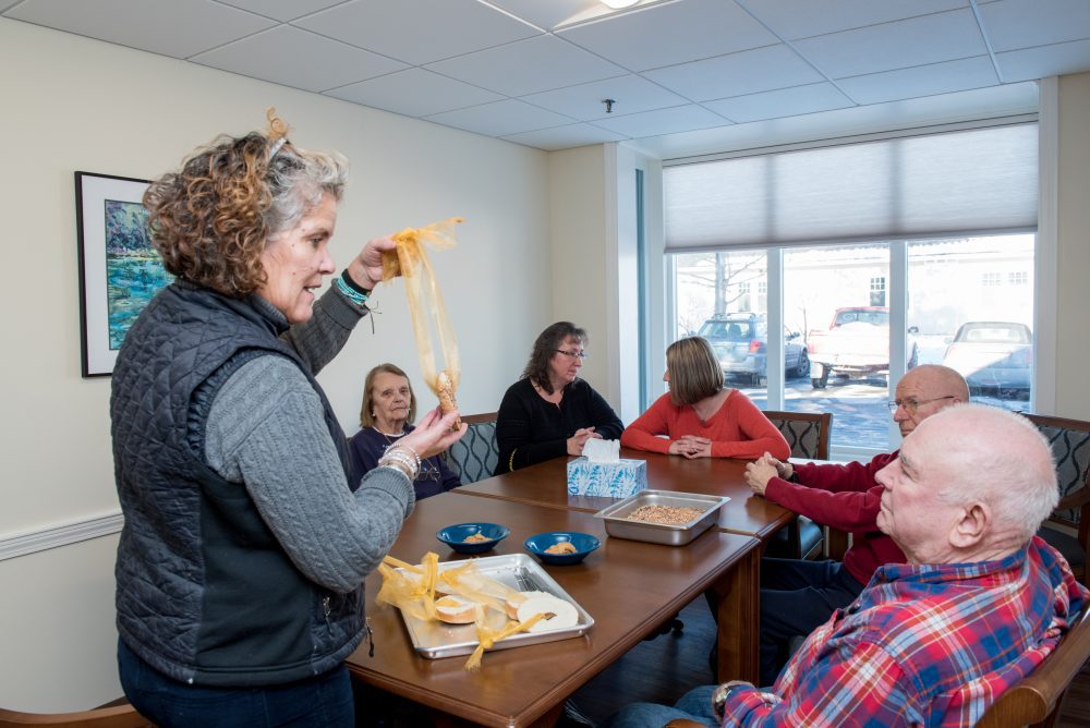 Seniors at a workshop on creating winter bird feeders