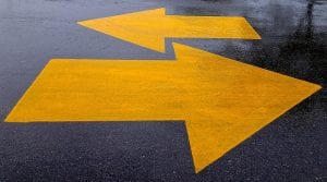 yellow arrows painted on sidewalk