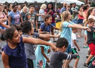 Kids dance at a neighborhood street festival