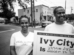 woman and man with sign