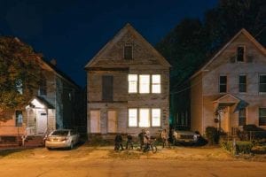 vacant home with lit windows