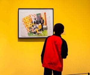 boy looking at artwork