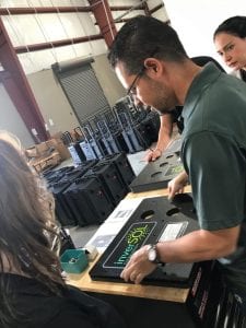 A man helps put together solar-powered generators in rural Puerto Rico.