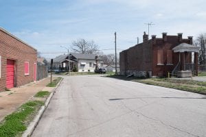 street with boarded commercial space