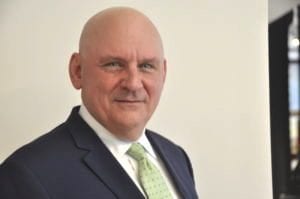 headshot of man in suit