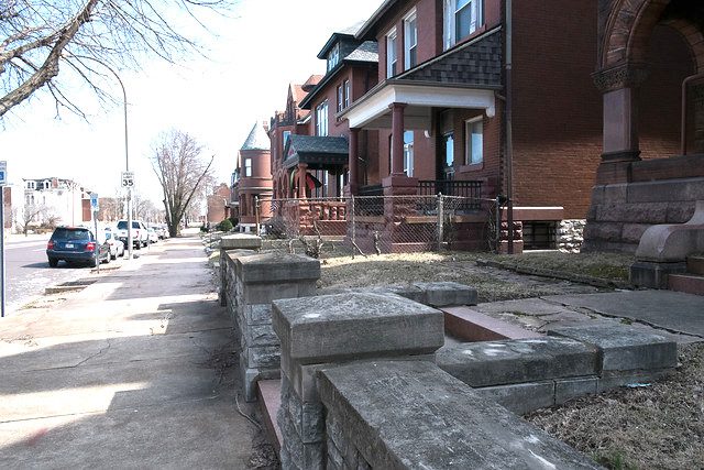 row of dark brick houses