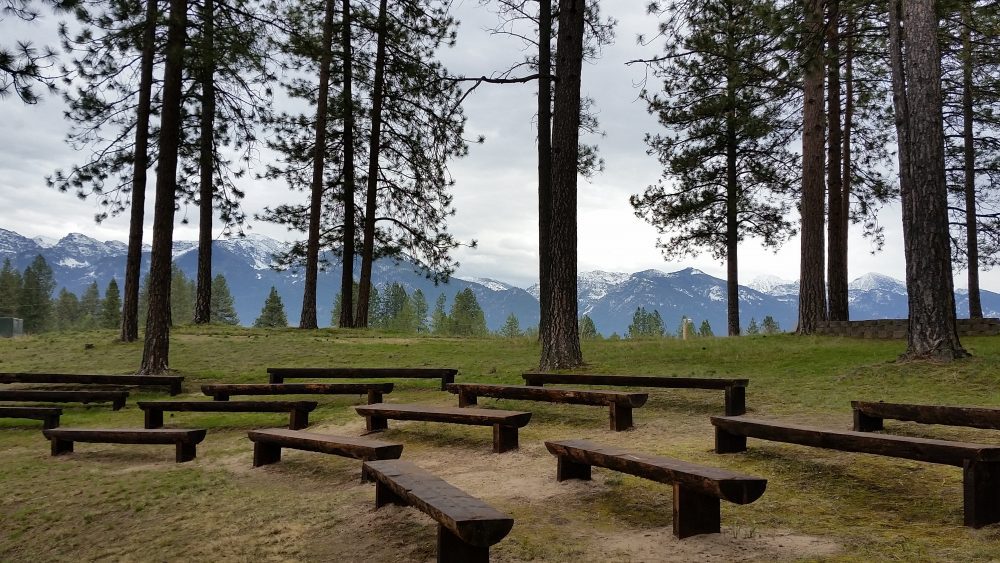 Outdoor seating, with nature surrounding the area. This is an outdoor classroom at Salish Kootenai College.