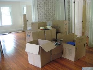 moving boxes in empty apartment