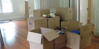 moving boxes in empty apartment