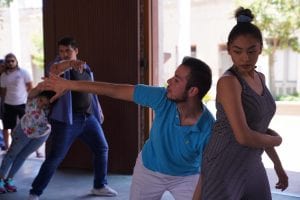 A male and female dancer perform a dance.