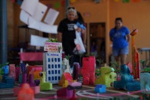 A model of Brownsville, Texas, with people in the back.