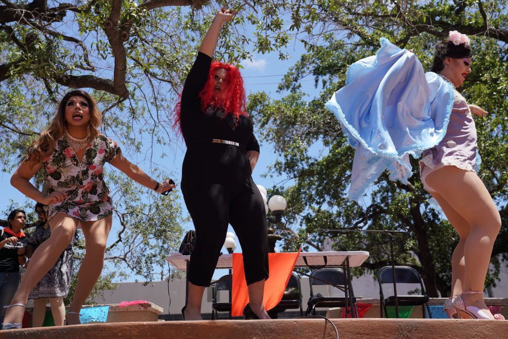 Dragtivists perform on stage at a Brownsville, Texas, event.